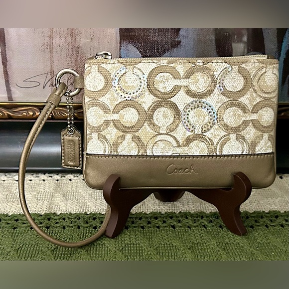 Coach Handbags - Coach Beige Signature Logo Wristlet with Metallic Accents